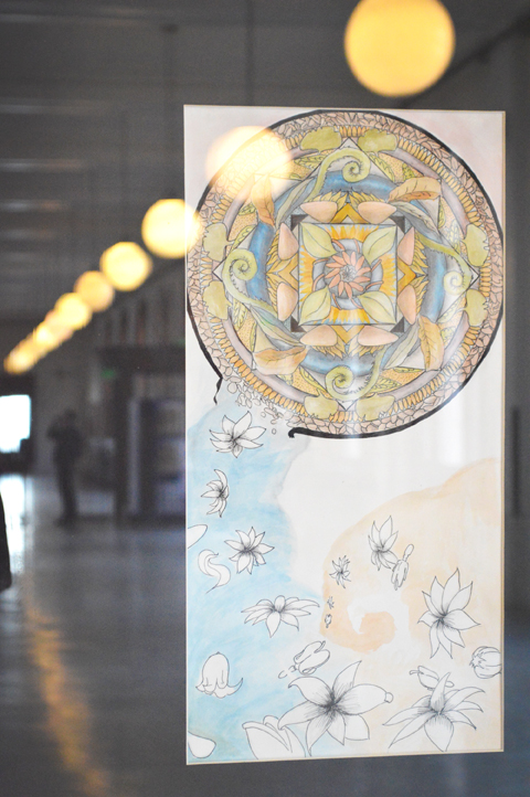 A group of elaborate mandalas bring life to the Old Post Office display cases.