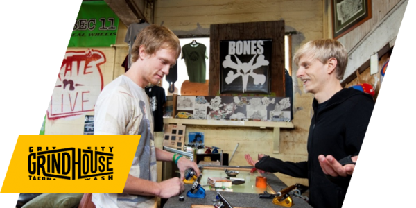 Grit City Grindhouse owner Bobby Boyle shows customer skateboard trucks